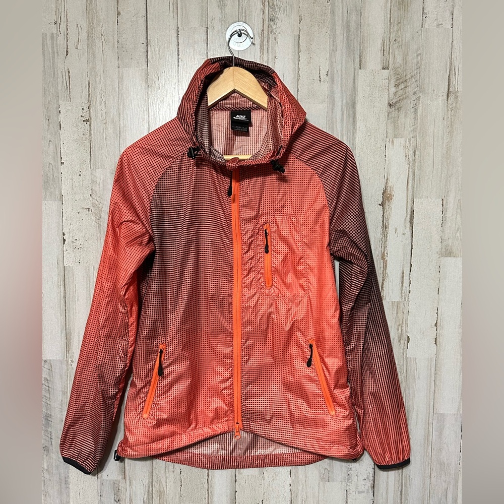Nike windbreaker jacket with an orange and black‎ gradient pattern